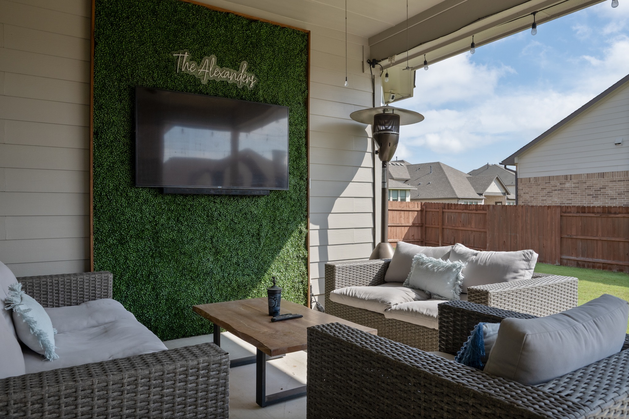 2100 Highland Ridge Road Georgetown, TX 78628 - Photo 26 of 30 An inviting outdoor living space awaits, complete with a mounted screen for entertainment.