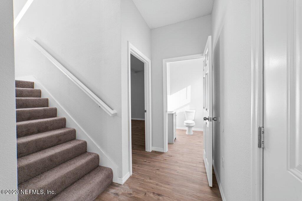 11816 Lem Turner Road Jacksonville, FL 32218 - Photo 11 of 24 a view of a hallway with wooden floor and entryway