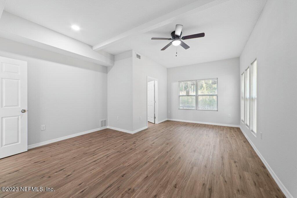 11816 Lem Turner Road Jacksonville, FL 32218 - Photo 15 of 24 wooden floor in an empty room with a window