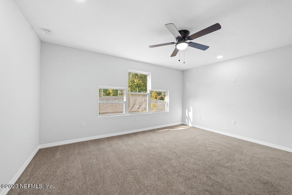 11816 Lem Turner Road Jacksonville, FL 32218 - Photo 18 of 24 a view of an empty room with a window