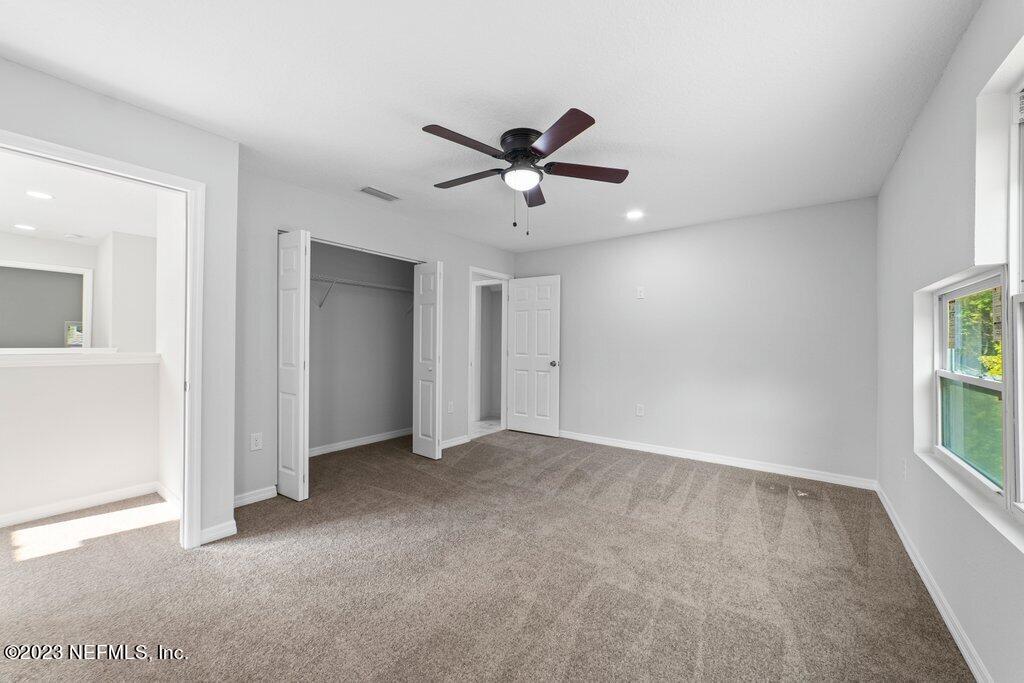 11816 Lem Turner Road Jacksonville, FL 32218 - Photo 19 of 24 a view of an empty room with a window