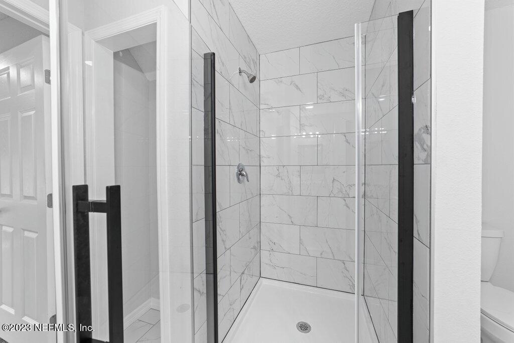 11816 Lem Turner Road Jacksonville, FL 32218 - Photo 21 of 24 a bathroom with a shower