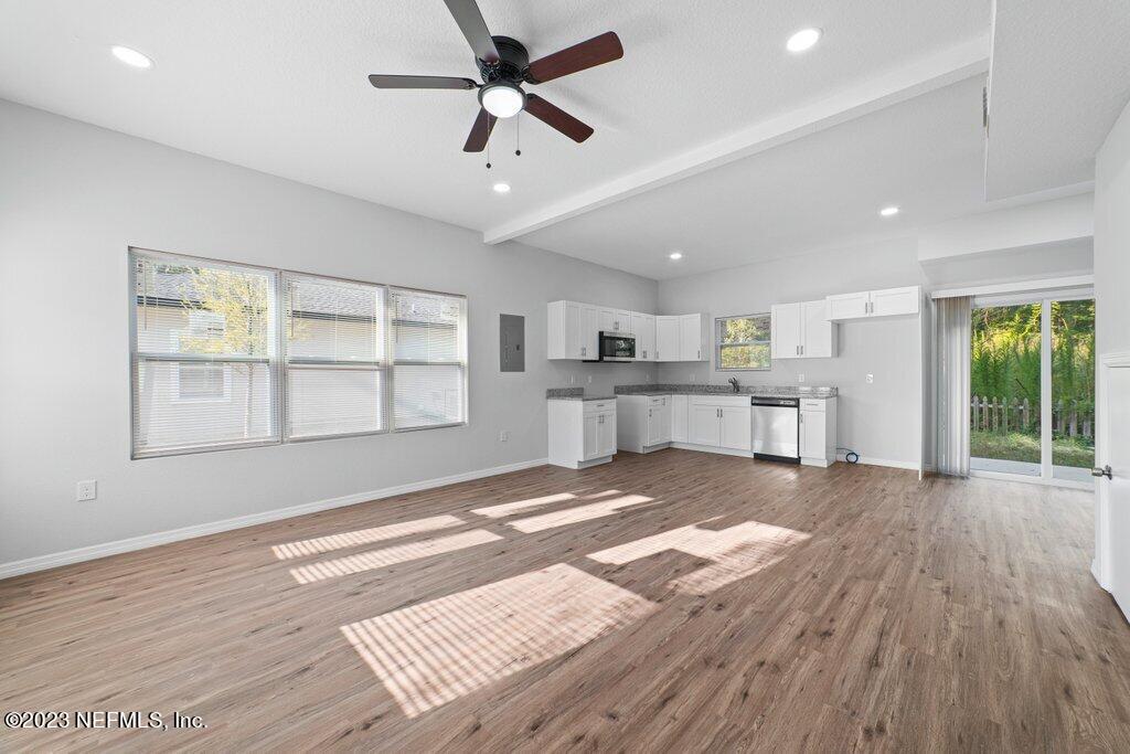 11816 Lem Turner Road Jacksonville, FL 32218 - Photo 4 of 24 a view of a kitchen with wooden floor and a kitchen