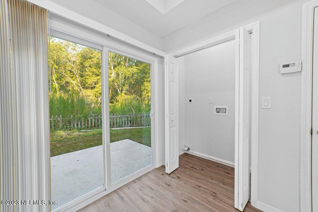 11816 Lem Turner Road Jacksonville, FL 32218 - Photo 9 of 24 a view of a room with window wooden floor and front door