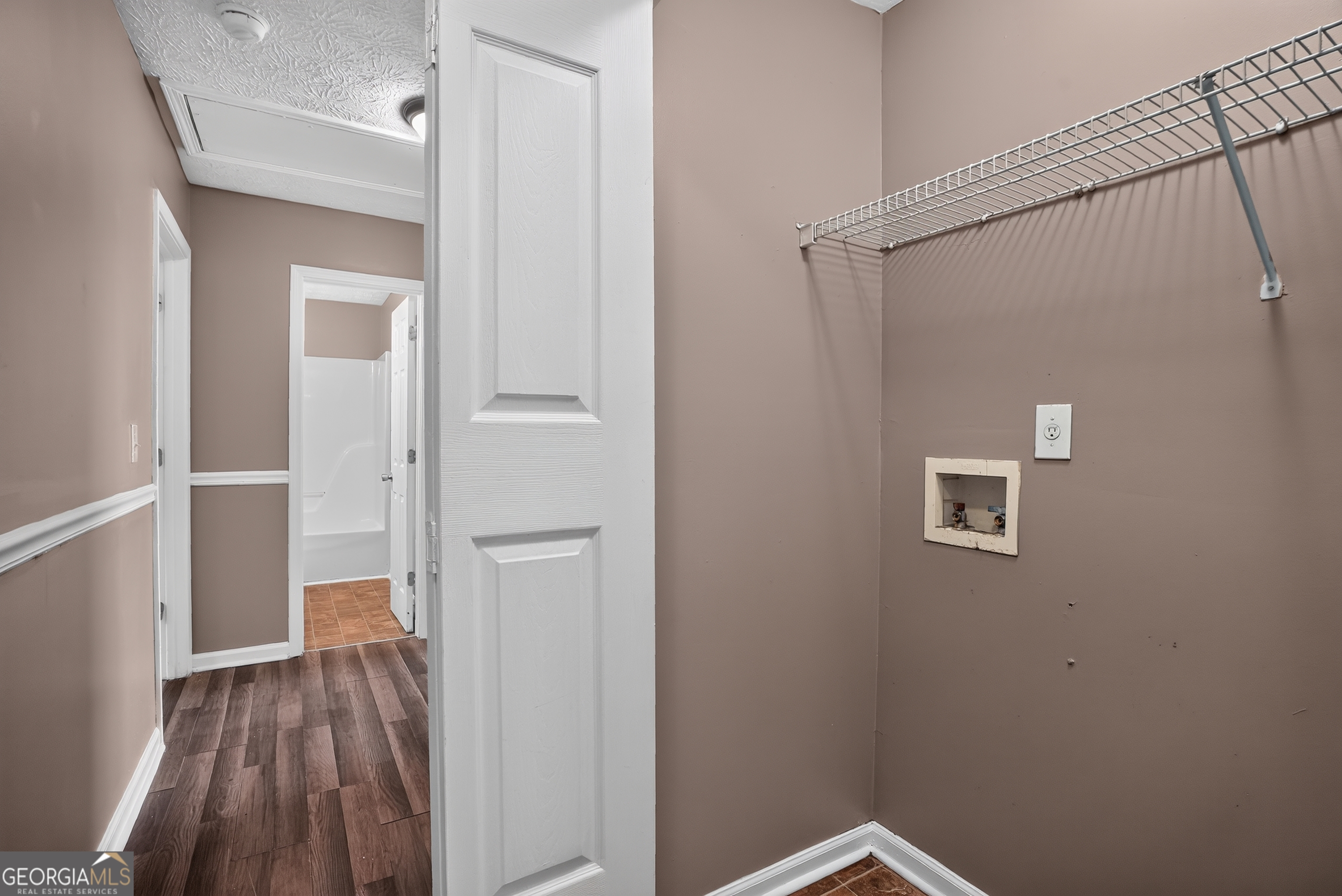 75 Linsley Way Covington, GA 30016 - Photo 39 of 48 a view of a hallway with wooden floor