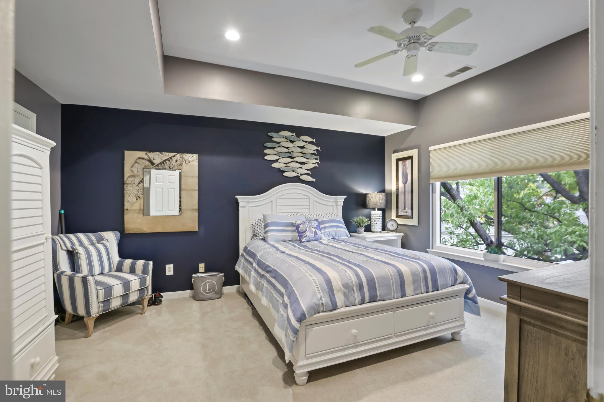 11218 Harbor Court Reston, VA 20191 - Photo 16 of 39 a bedroom with a large bed and a couch