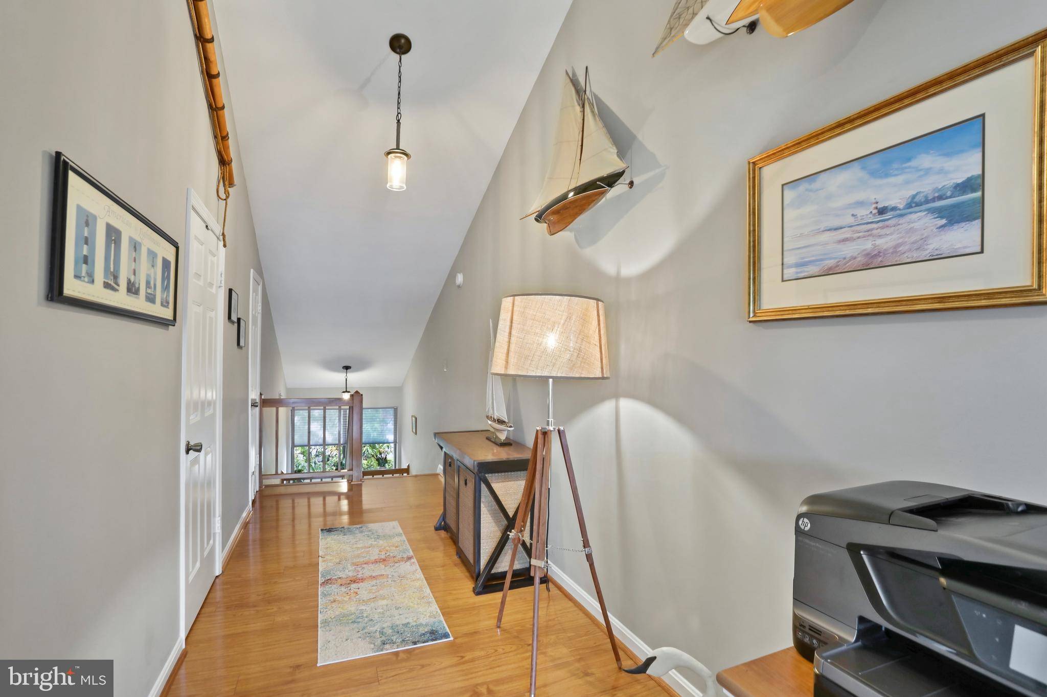 11218 Harbor Court Reston, VA 20191 - Photo 19 of 39 a view of a hallway with workspace and mirror