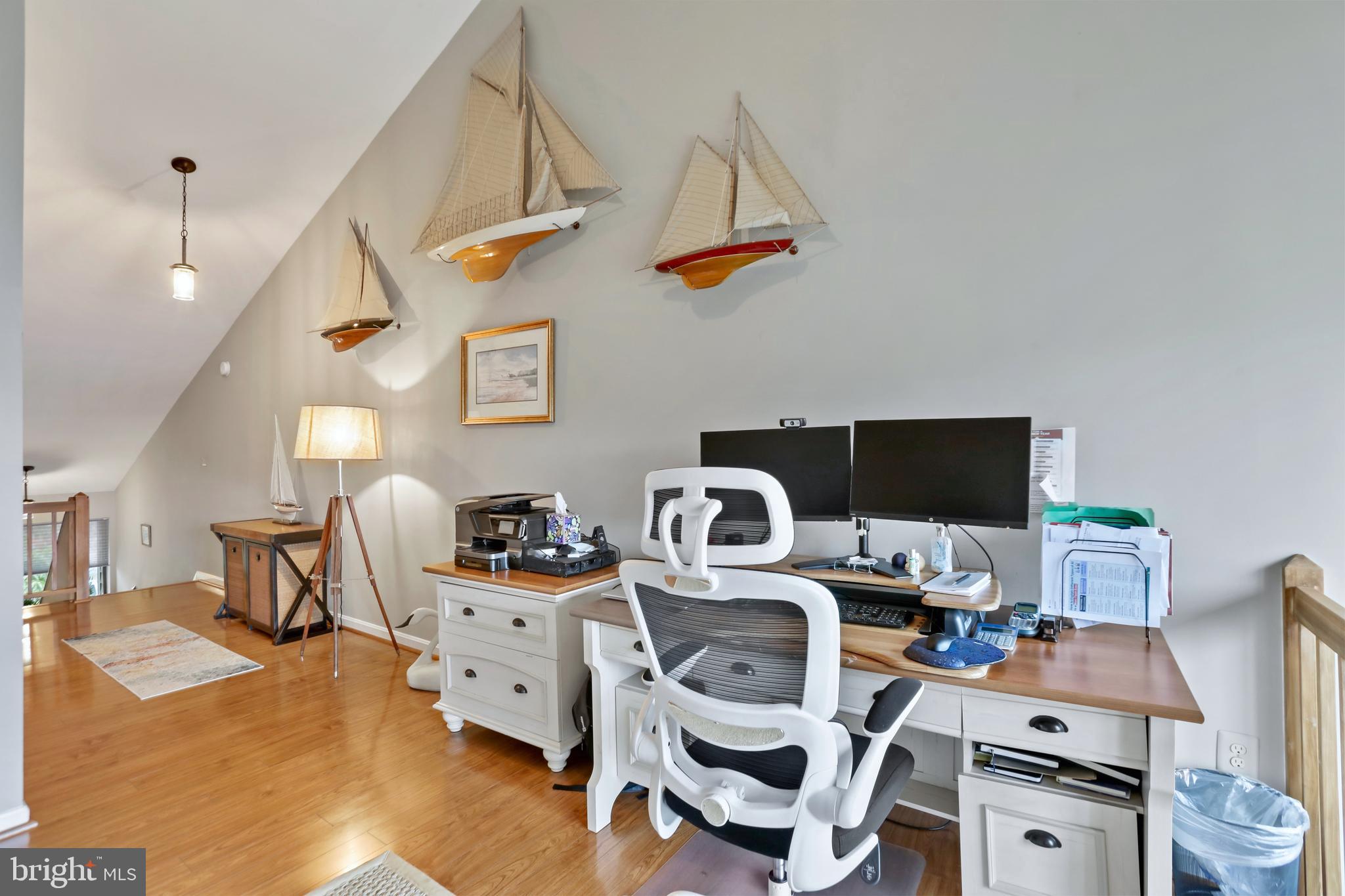 11218 Harbor Court Reston, VA 20191 - Photo 20 of 39 a work room with furniture a rug and a flat screen tv