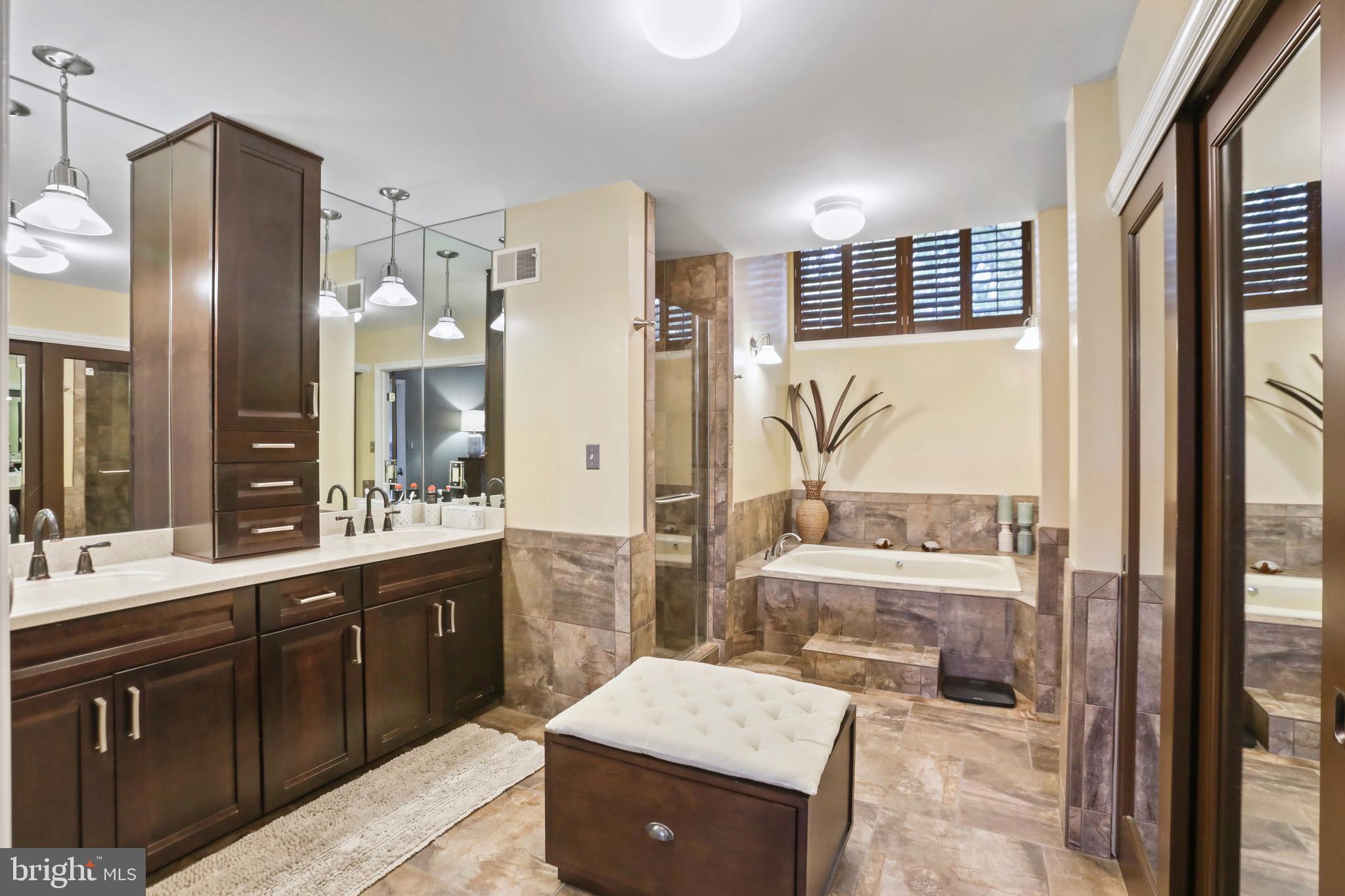 11218 Harbor Court Reston, VA 20191 - Photo 24 of 39 a large bathroom with a large tub and sink