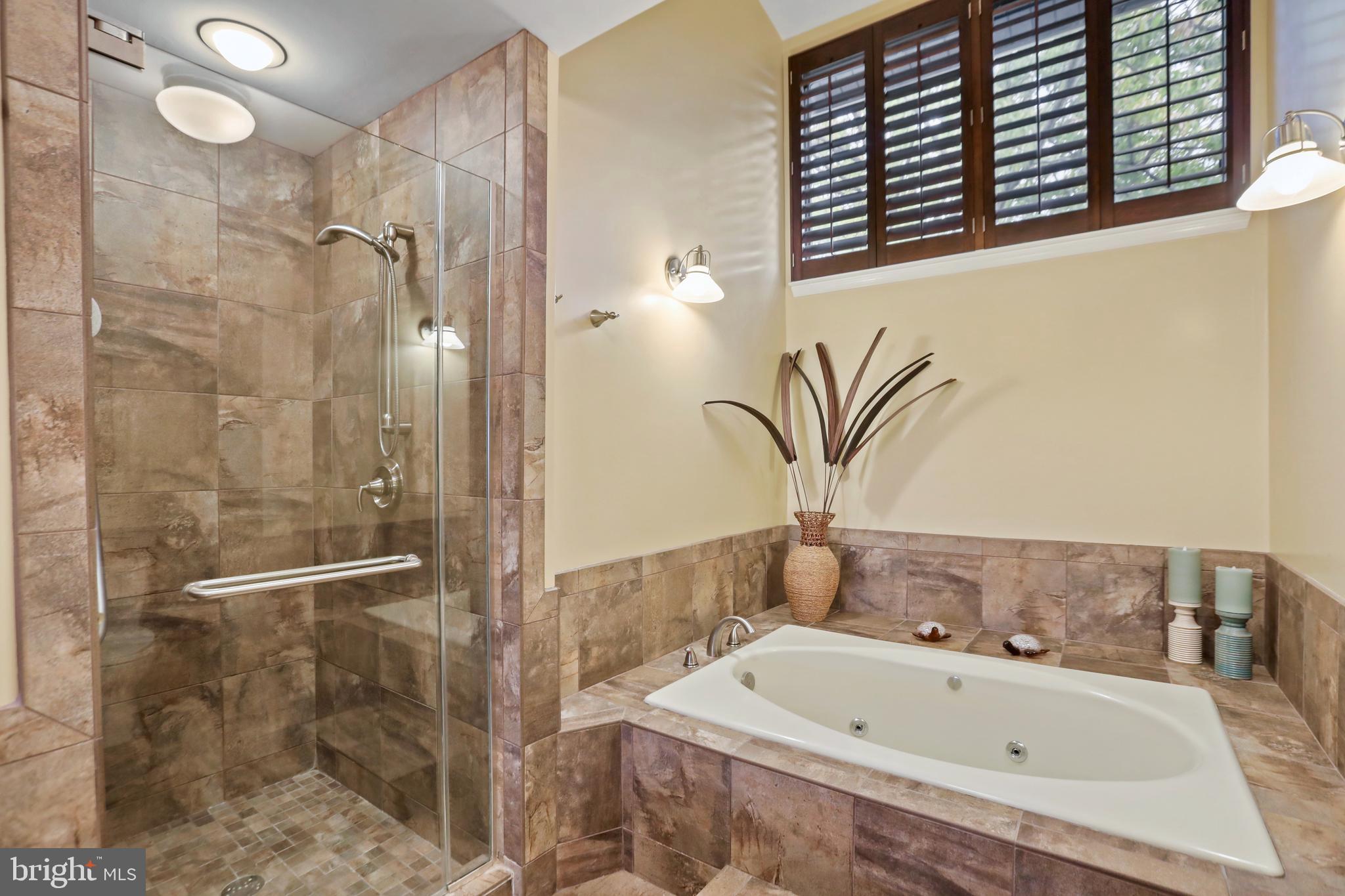 11218 Harbor Court Reston, VA 20191 - Photo 26 of 39 a bathroom with a bathtub and shower