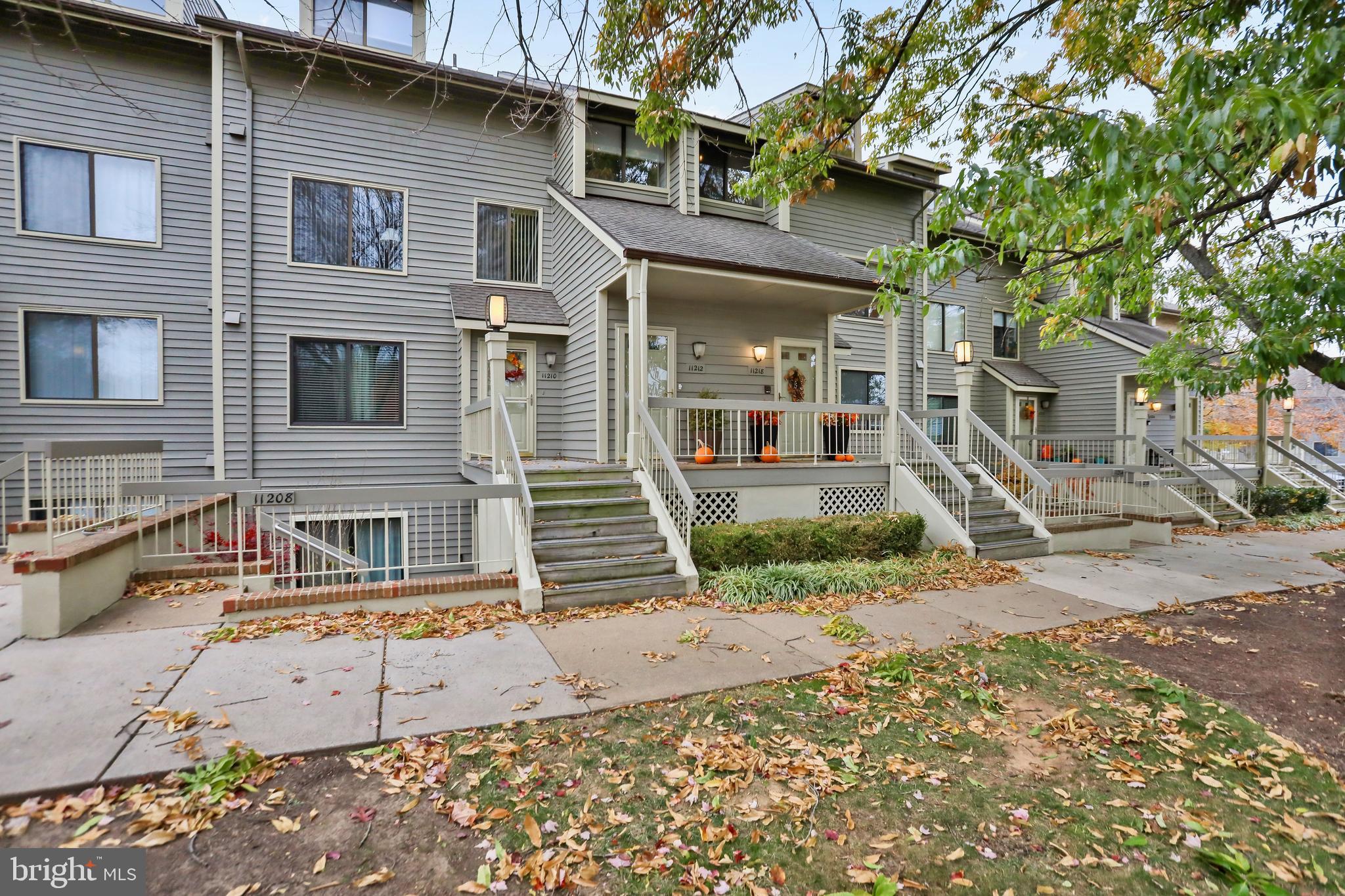 11218 Harbor Court Reston, VA 20191 - Photo 30 of 39 a front view of a house with a yard