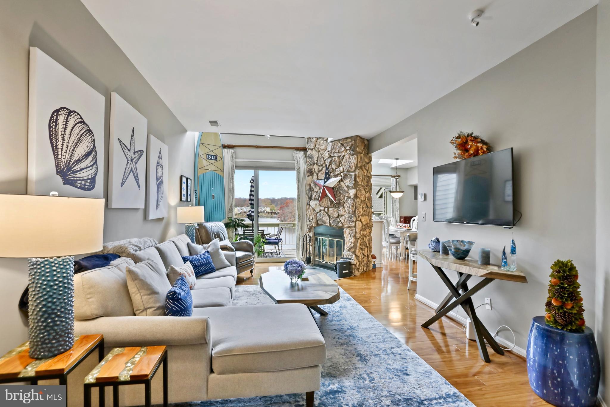 11218 Harbor Court Reston, VA 20191 - Photo 4 of 39 a living room with furniture and a flat screen tv