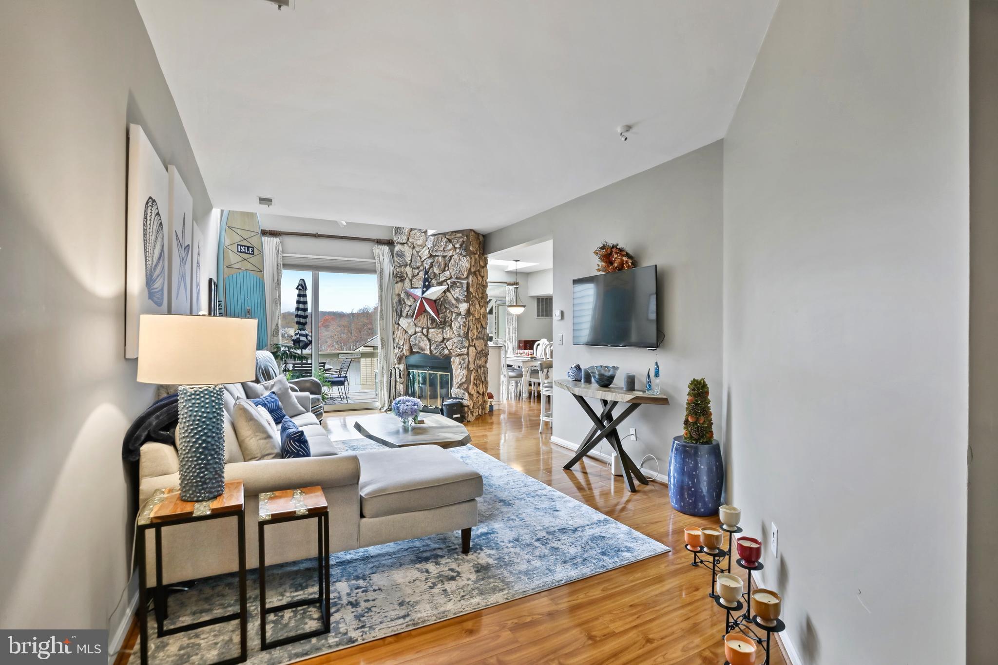 11218 Harbor Court Reston, VA 20191 - Photo 5 of 39 a living room with furniture and a flat screen tv