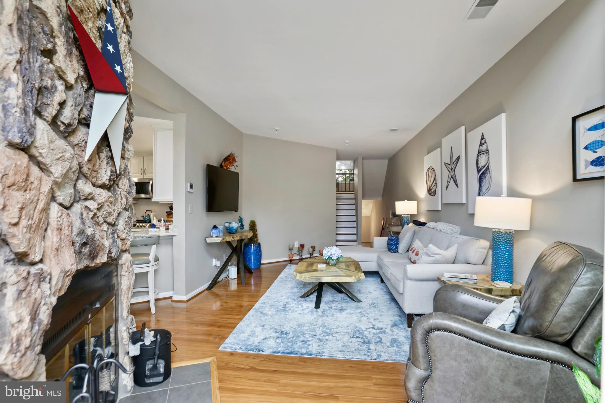 11218 Harbor Court Reston, VA 20191 - Photo 6 of 39 a living room with furniture and a fireplace