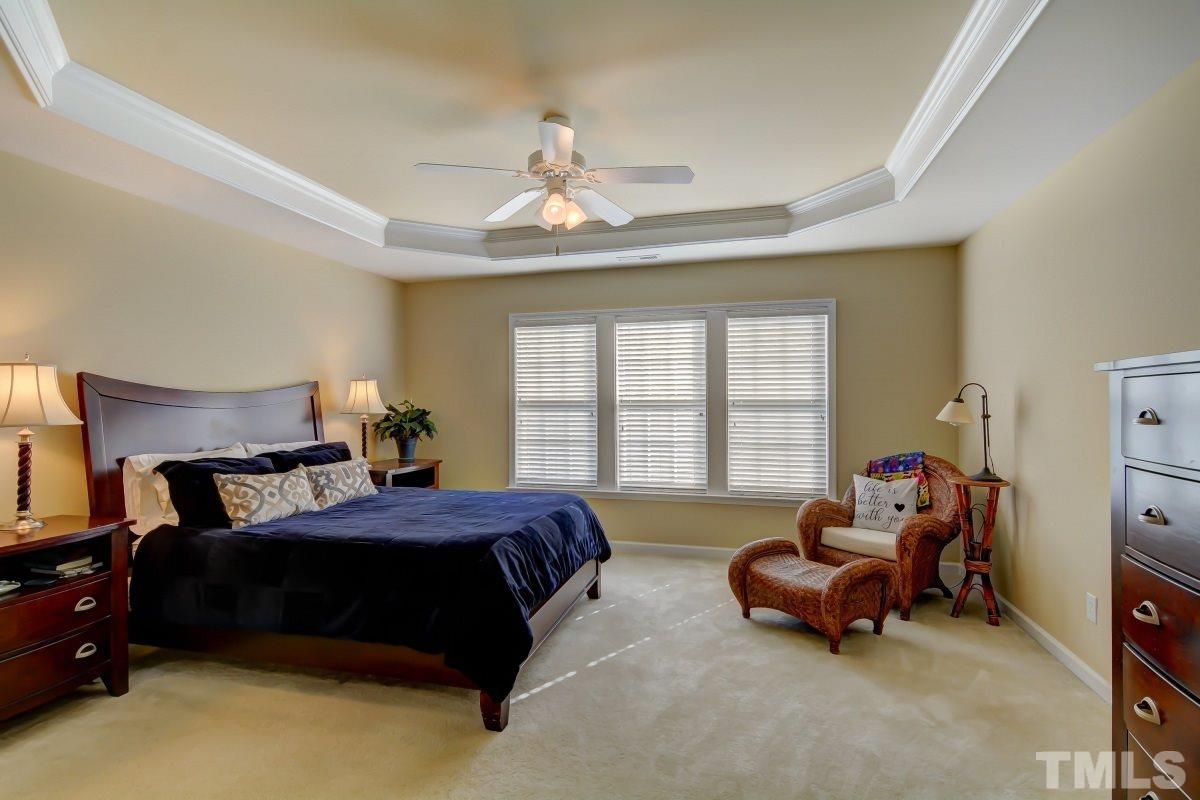 3902 Sunset Maple Court Raleigh, NC 27612 - Photo 12 of 21 a bedroom with bed and window