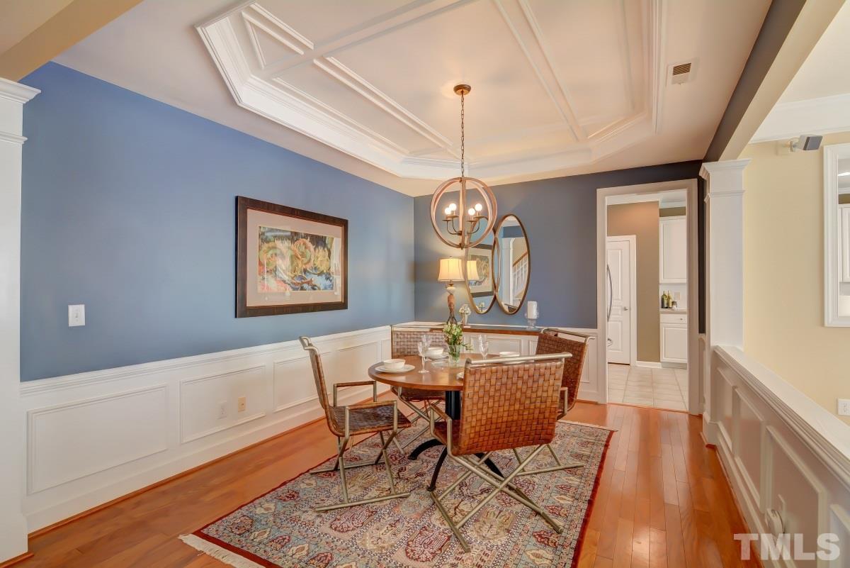3902 Sunset Maple Court Raleigh, NC 27612 - Photo 3 of 21 a view of a dining room with furniture window and wooden floor