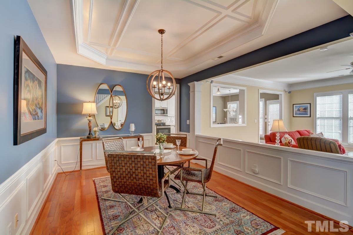 3902 Sunset Maple Court Raleigh, NC 27612 - Photo 4 of 21 a view of a dining room with furniture window and wooden floor