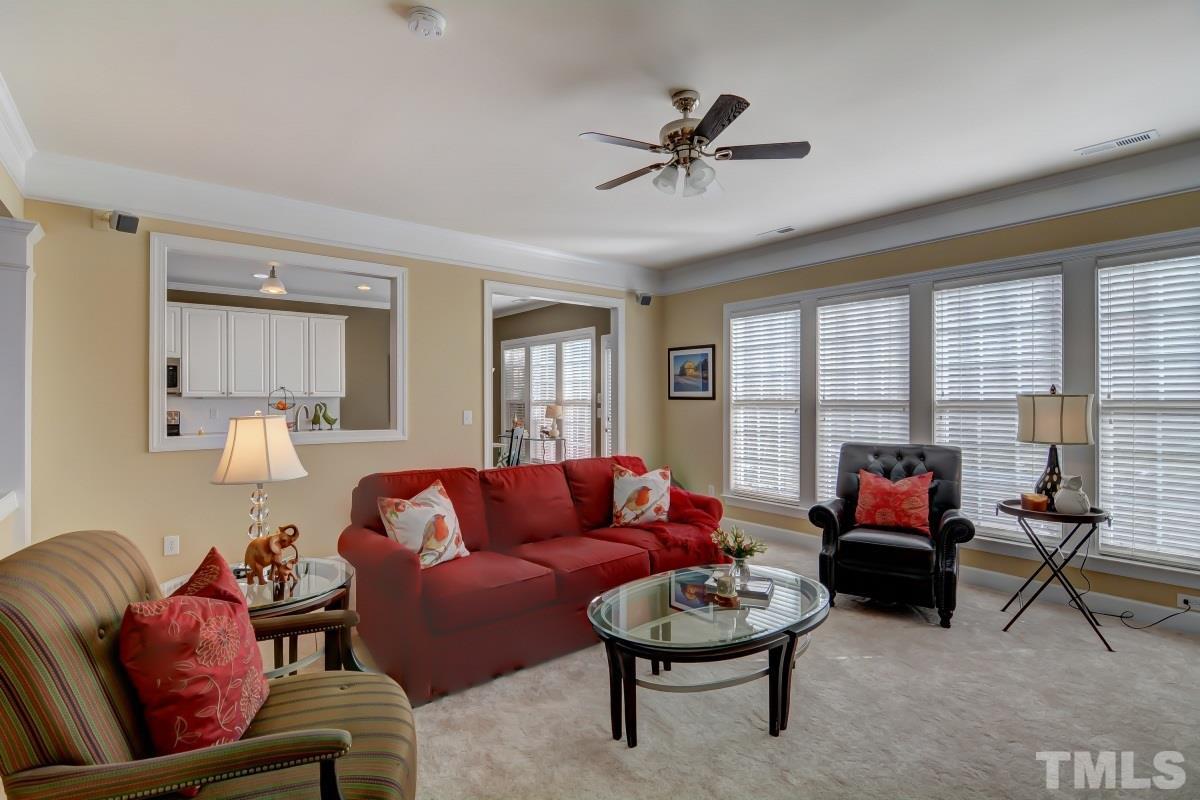 3902 Sunset Maple Court Raleigh, NC 27612 - Photo 6 of 21 a living room with furniture and a large window