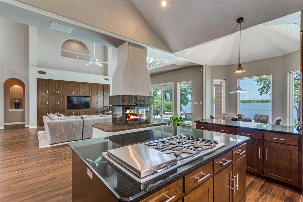 452 Windjammer Lane Azle, TX 76020 - Photo 13 of 40 a kitchen with a stove and a wooden floors