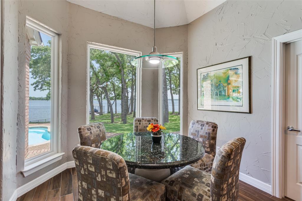 452 Windjammer Lane Azle, TX 76020 - Photo 14 of 40 a dining room with furniture large windows and a chandelier