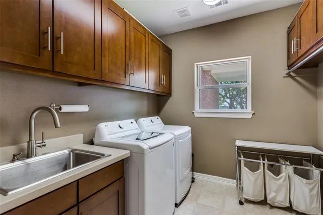 a utility room with cabinets