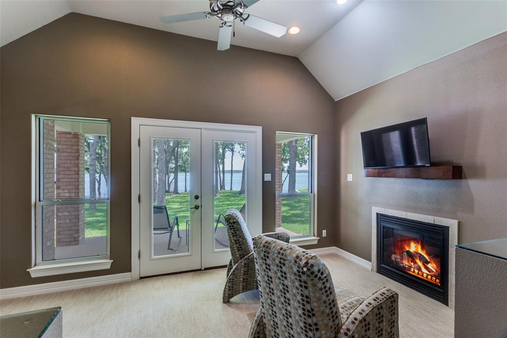 452 Windjammer Lane Azle, TX 76020 - Photo 23 of 40 a living room with furniture and a fireplace