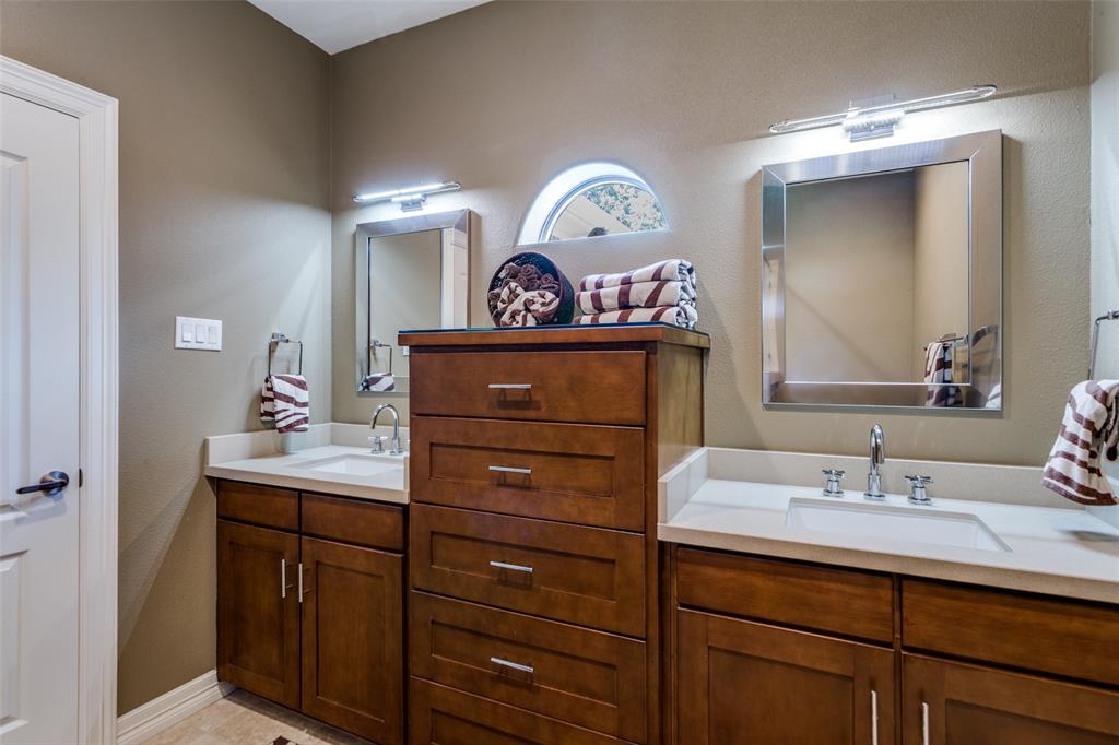 452 Windjammer Lane Azle, TX 76020 - Photo 24 of 40 a bathroom with a sink mirror and vanity