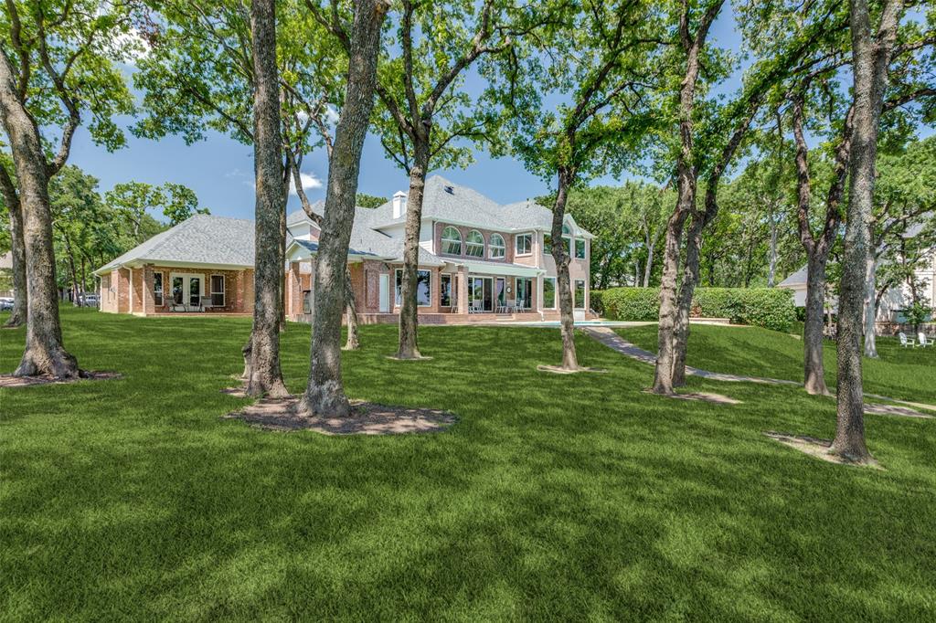 452 Windjammer Lane Azle, TX 76020 - Photo 3 of 40 a front view of a house with a yard