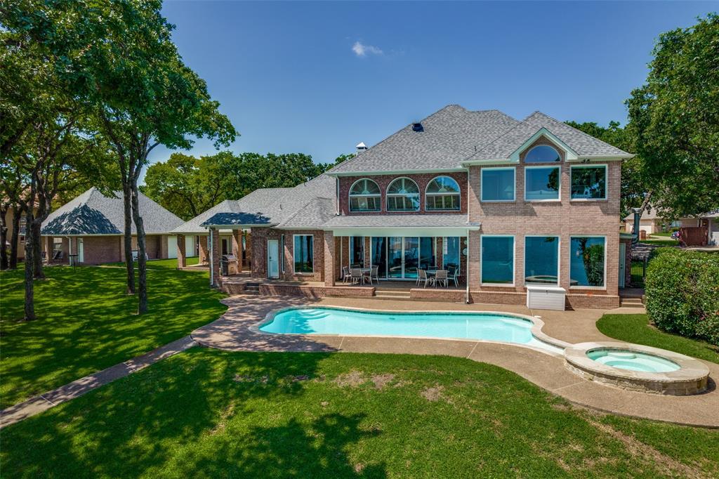 452 Windjammer Lane Azle, TX 76020 - Photo 32 of 40 a front view of a house with a yard table and chairs