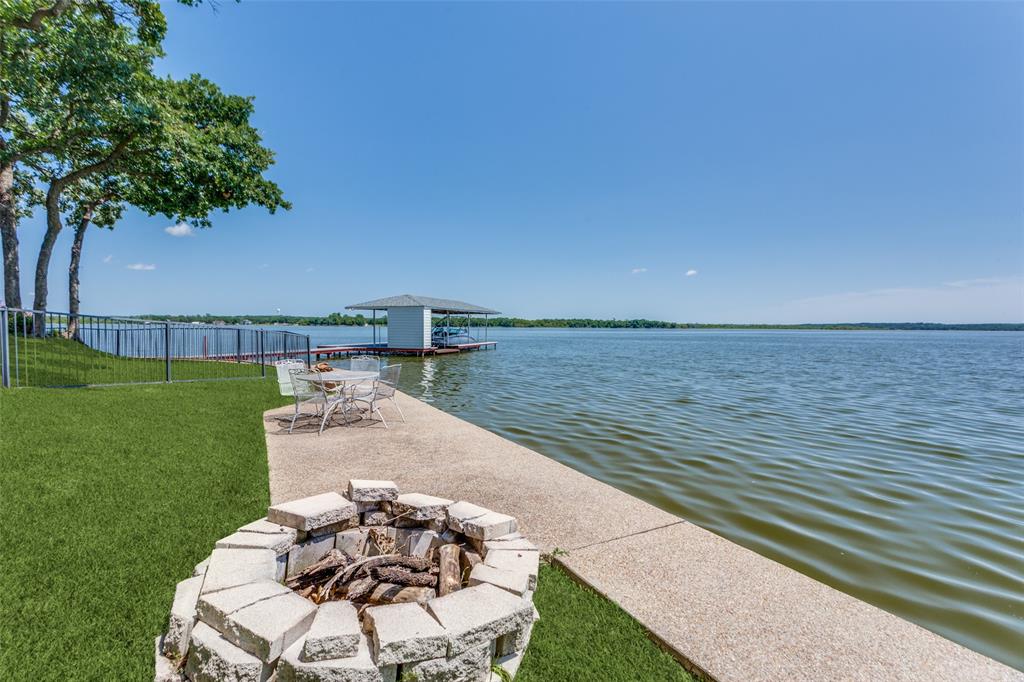 452 Windjammer Lane Azle, TX 76020 - Photo 37 of 40 a terrace with a garden and seating space