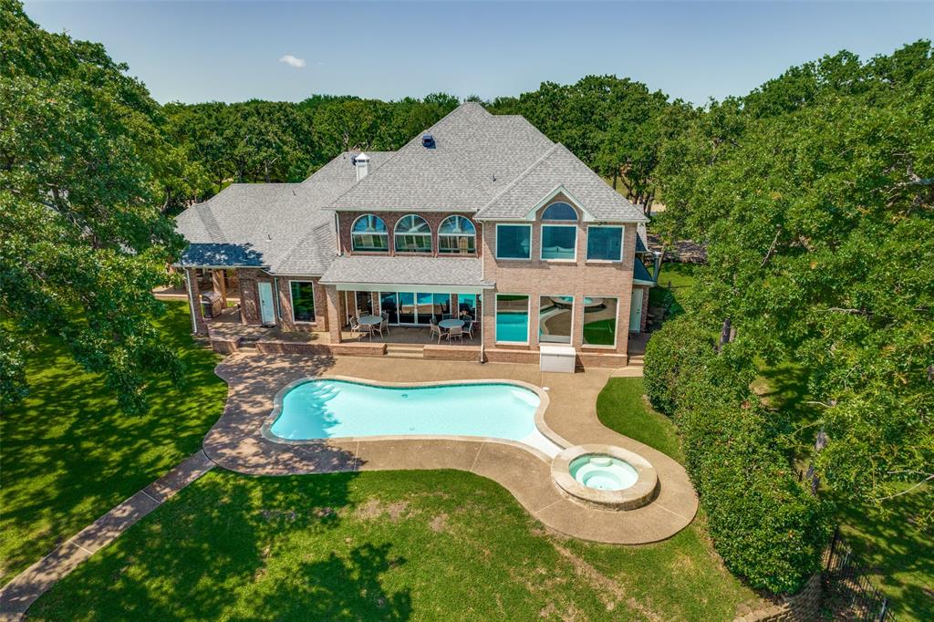 452 Windjammer Lane Azle, TX 76020 - Photo 39 of 40 a view of a house with swimming pool and a yard