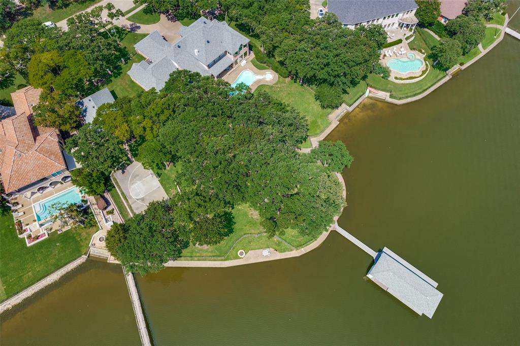 452 Windjammer Lane Azle, TX 76020 - Photo 4 of 40 an aerial view of a house with a yard and lake view