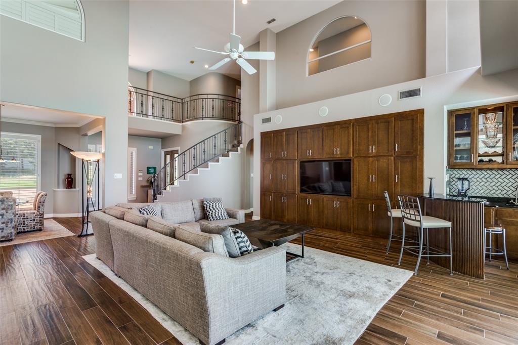 452 Windjammer Lane Azle, TX 76020 - Photo 7 of 40 a living room with furniture and a flat screen tv