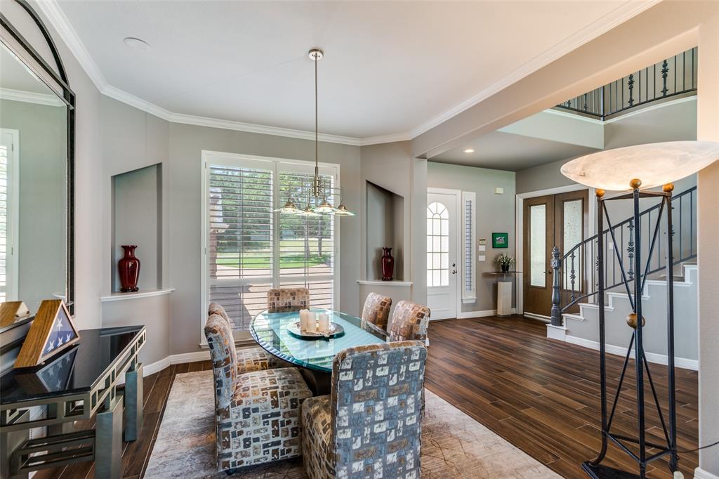 452 Windjammer Lane Azle, TX 76020 - Photo 8 of 40 a view of a dining room with furniture window and wooden floor