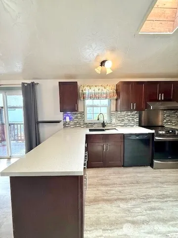 a kitchen with a sink and cabinets