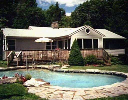 34 Shadblow Hill Road Ridgefield, CT 06877 - Photo 1 of 1 a view of a house with swimming pool