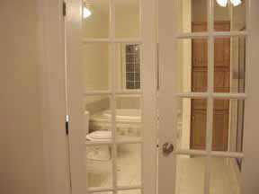 1809 Willis Court Fort Mill, SC 29708 - Photo 7 of 8 a bathroom with a glass shower door