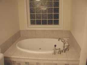 1809 Willis Court Fort Mill, SC 29708 - Photo 8 of 8 a white bath tub sitting next to a window