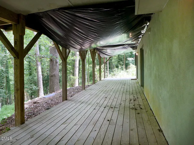 a view of porch with wooden floor