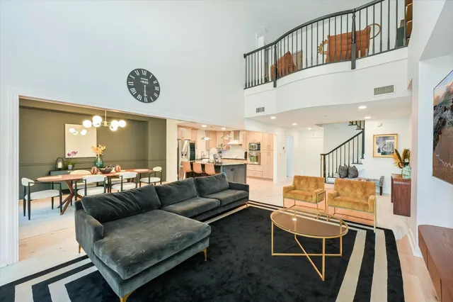a living room with furniture and a table