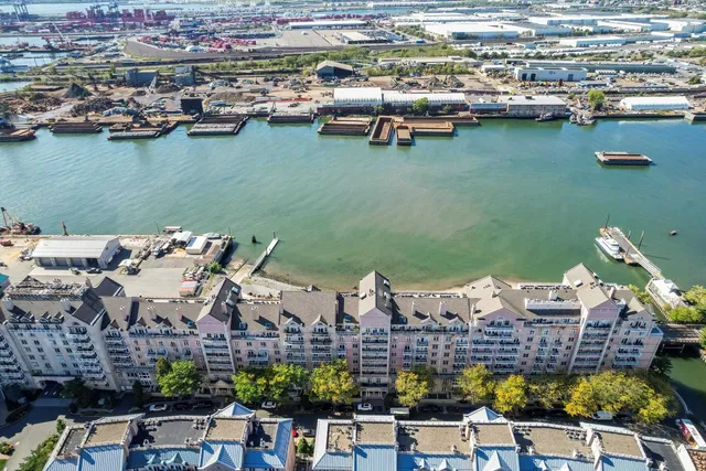 an aerial view of a house with a lake view