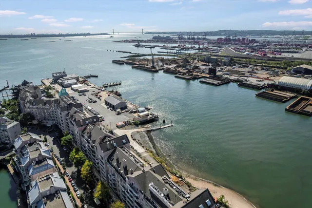 an aerial view of a house with a lake view