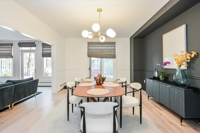 a view of a dining room with furniture window and wooden floor