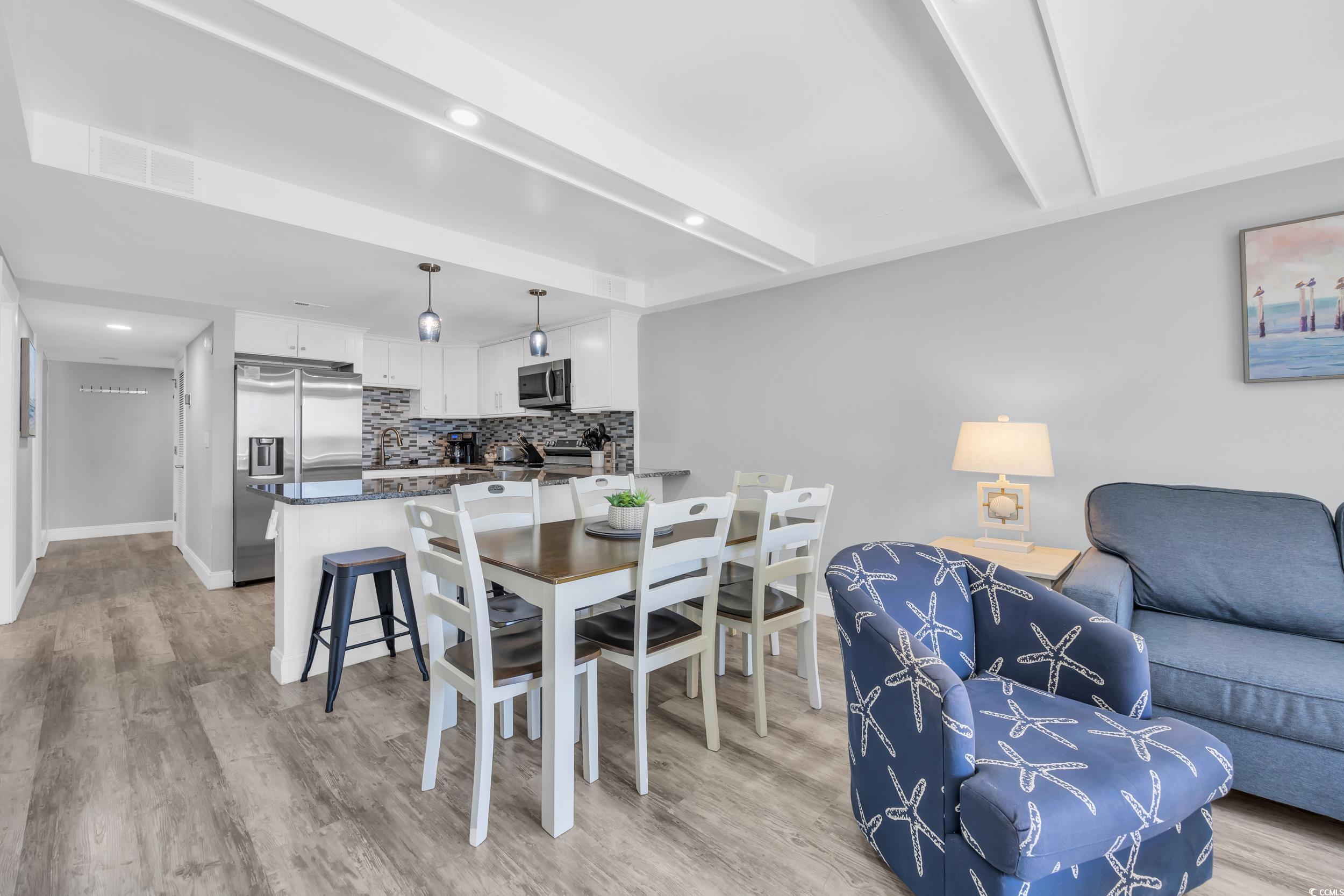 601 Mitchell Drive, Unit 203 Myrtle Beach, SC 29577 - Photo 14 of 40 Dining area featuring light wood-style floors, beam ceiling, and recessed lighting