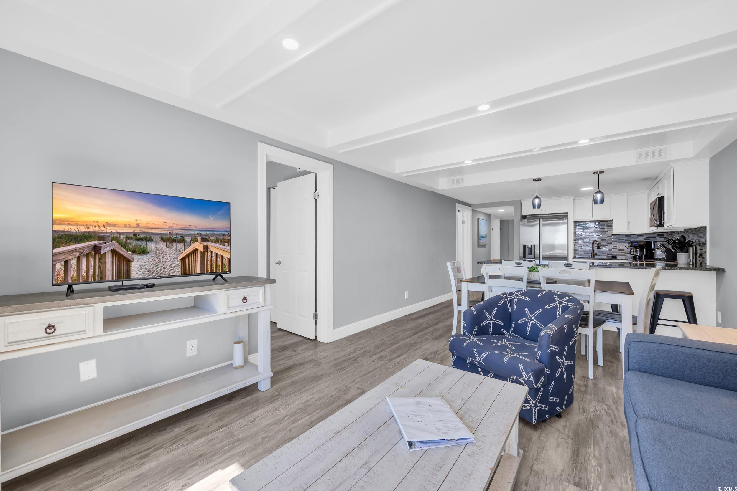601 Mitchell Drive, Unit 203 Myrtle Beach, SC 29577 - Photo 16 of 40 Living room featuring beamed ceiling, light wood-type flooring, and recessed lighting