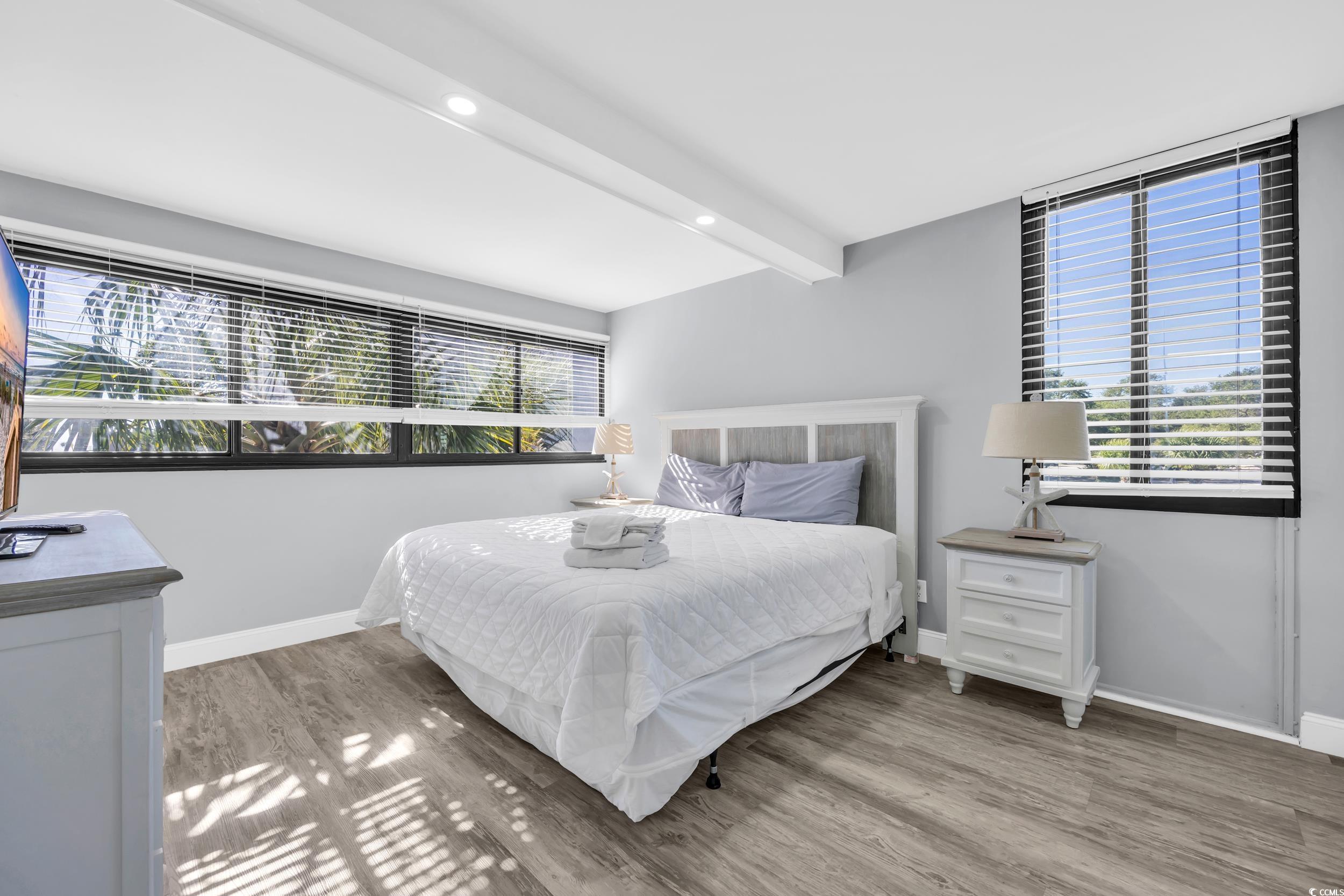 601 Mitchell Drive, Unit 203 Myrtle Beach, SC 29577 - Photo 21 of 40 Bedroom featuring beam ceiling, light wood-type flooring, and recessed lighting