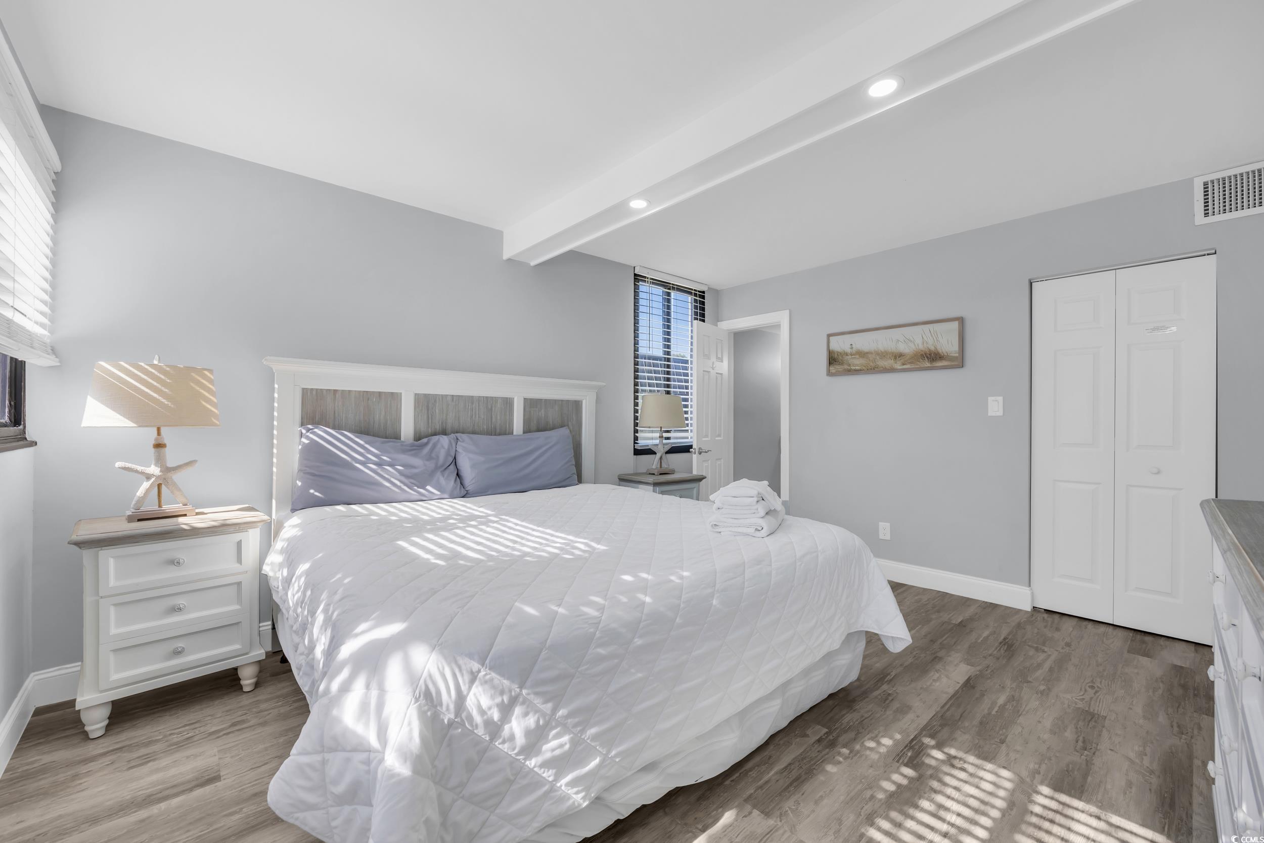 601 Mitchell Drive, Unit 203 Myrtle Beach, SC 29577 - Photo 23 of 40 Bedroom with beam ceiling, light wood finished floors, recessed lighting, and a closet