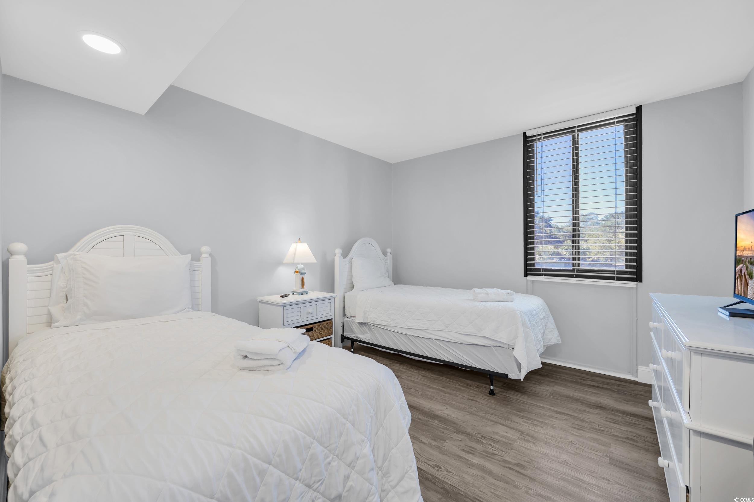 601 Mitchell Drive, Unit 203 Myrtle Beach, SC 29577 - Photo 25 of 40 Bedroom featuring wood finished floors and recessed lighting