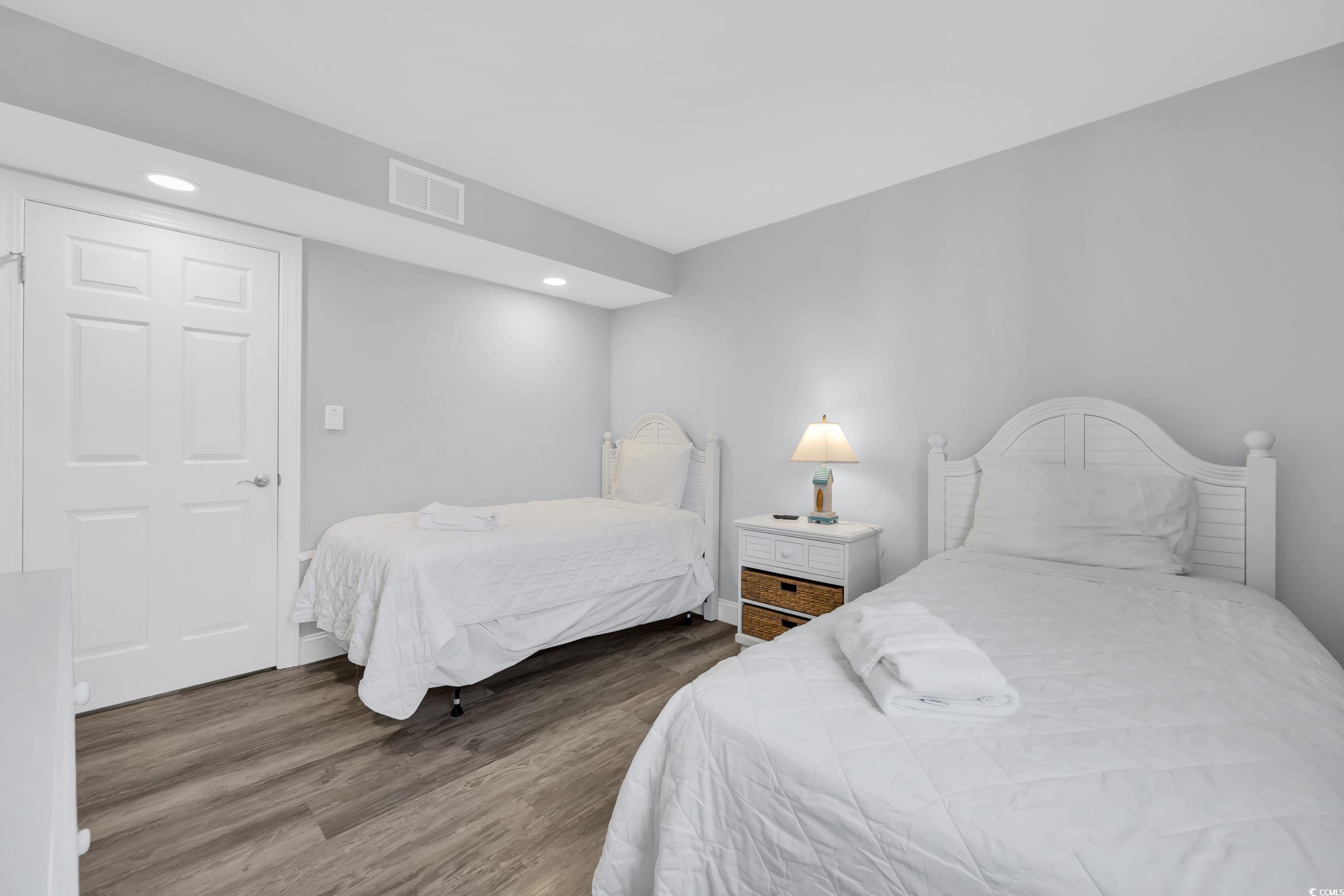 601 Mitchell Drive, Unit 203 Myrtle Beach, SC 29577 - Photo 26 of 40 Bedroom with dark wood-style floors and recessed lighting