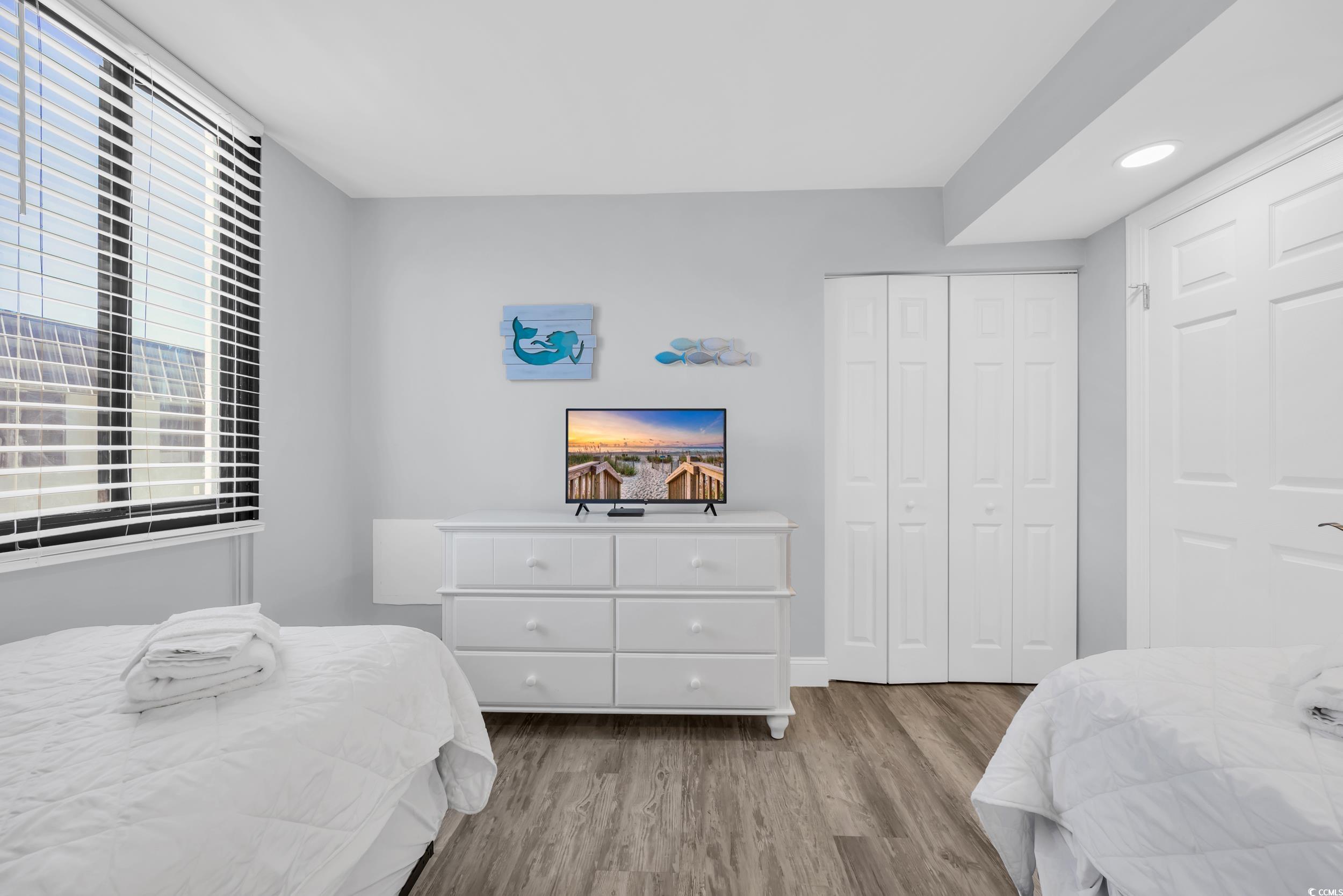 601 Mitchell Drive, Unit 203 Myrtle Beach, SC 29577 - Photo 27 of 40 Bedroom featuring wood finished floors, a closet, and recessed lighting